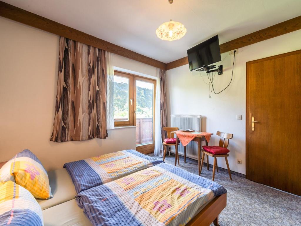 Postel nebo postele na pokoji v ubytování Contemporary Apartment in Maishofen near Ski Area