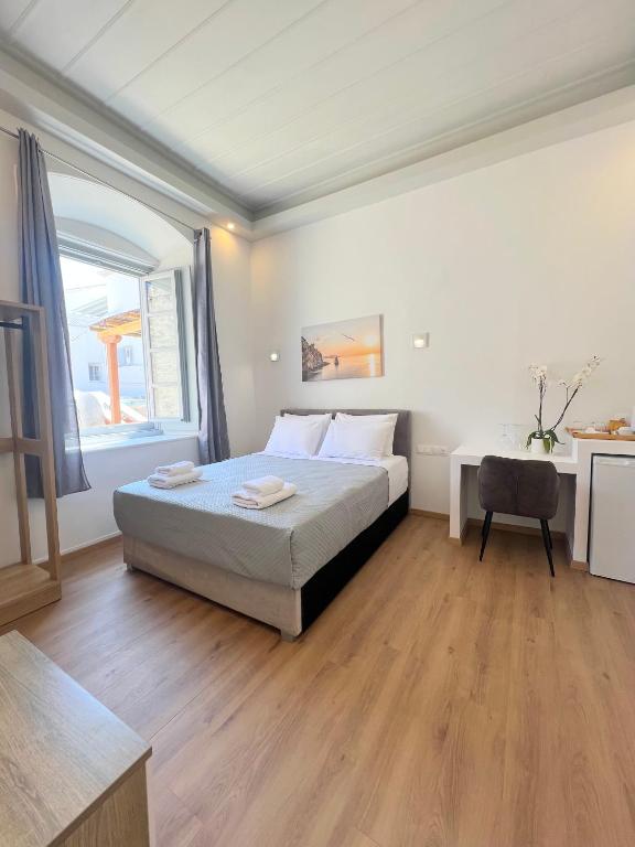 Postel nebo postele na pokoji v ubytování Douskos Guesthouse
