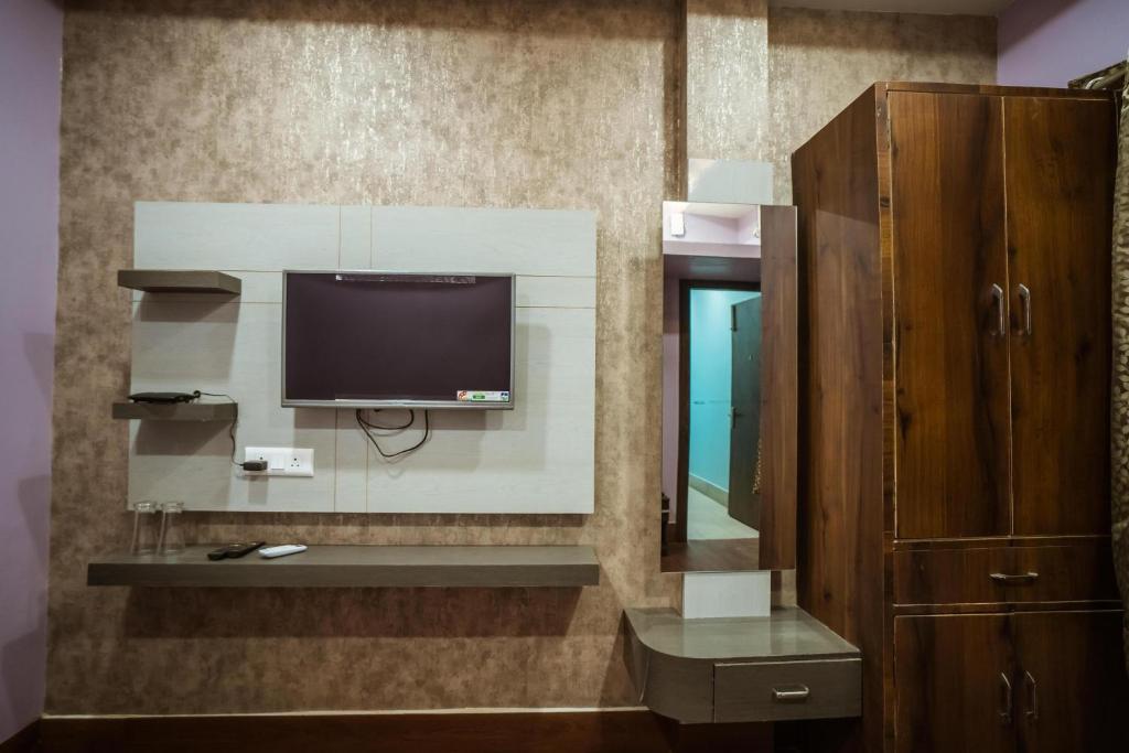 TV a/nebo společenská místnost v ubytování HOTEL DEVINE Inn