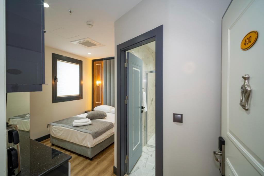 Postel nebo postele na pokoji v ubytování Rusel Park Residence