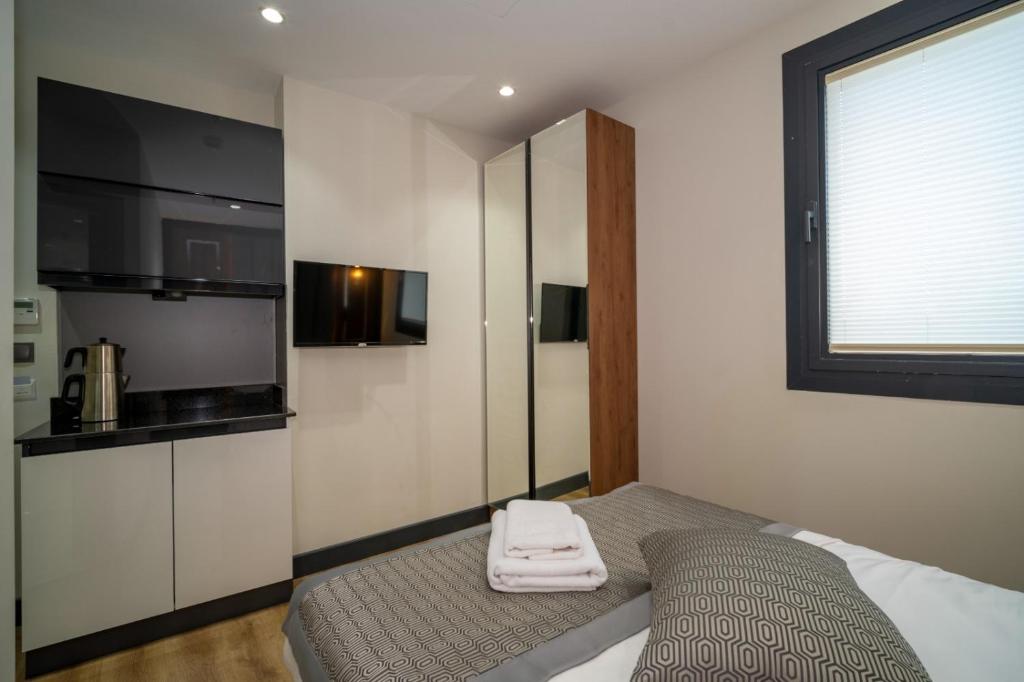 Postel nebo postele na pokoji v ubytování Rusel Park Residence