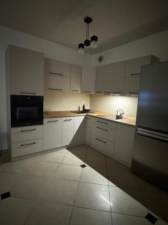 Kuchyňa alebo kuchynka v ubytovaní Apartament Zeta Park Centrum