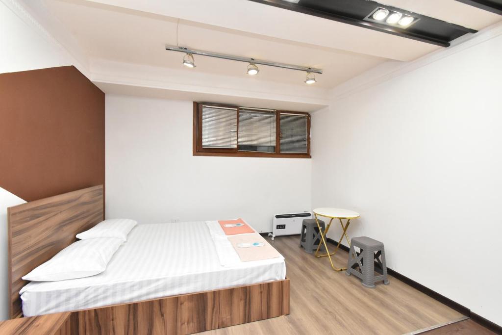 Postel nebo postele na pokoji v ubytování City-Lime Guest House