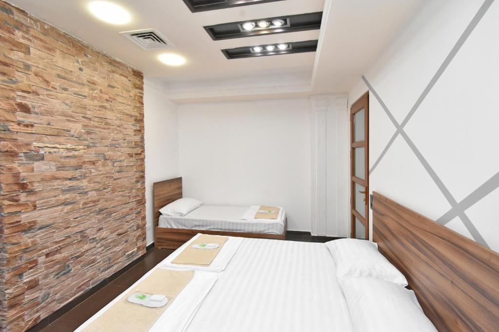 Postel nebo postele na pokoji v ubytování City-Lime Guest House