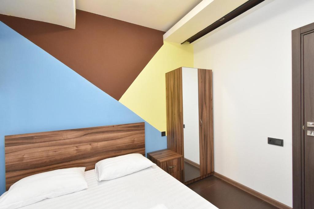 Postel nebo postele na pokoji v ubytování City-Lime Guest House