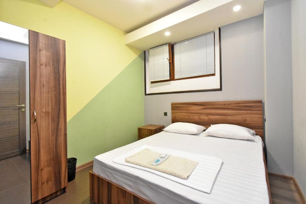Postel nebo postele na pokoji v ubytování City-Lime Guest House
