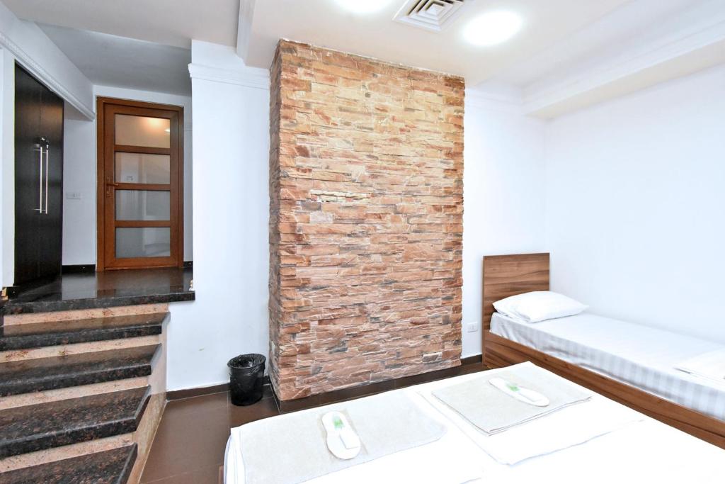 Postel nebo postele na pokoji v ubytování City-Lime Guest House