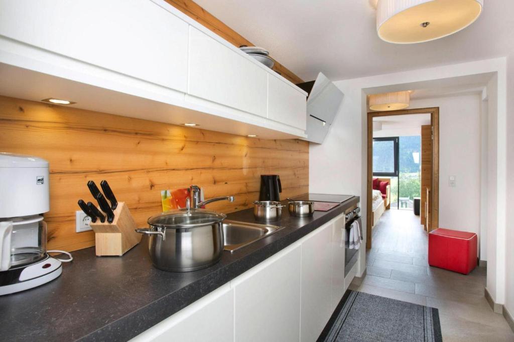 A kitchen or kitchenette at Apartment in Neukirchen with a balcony