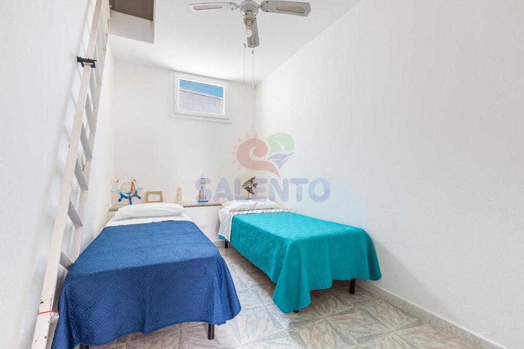 Postel nebo postele na pokoji v ubytování Salentoandmore - Affaccio sul mare