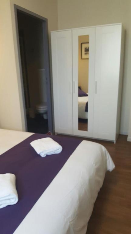Postel nebo postele na pokoji v ubytování Hotel Belvue