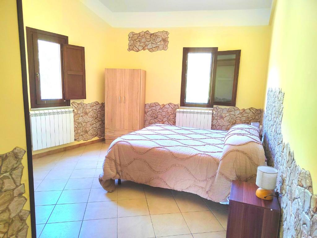 Łóżko lub łóżka w pokoju w obiekcie Villaggio dei Balocchi