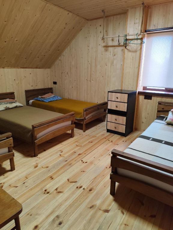 Postel nebo postele na pokoji v ubytování садиба ТУГАН-ДВІР