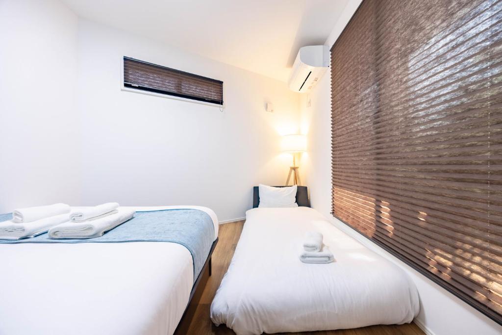 Postel nebo postele na pokoji v ubytování First Choice
