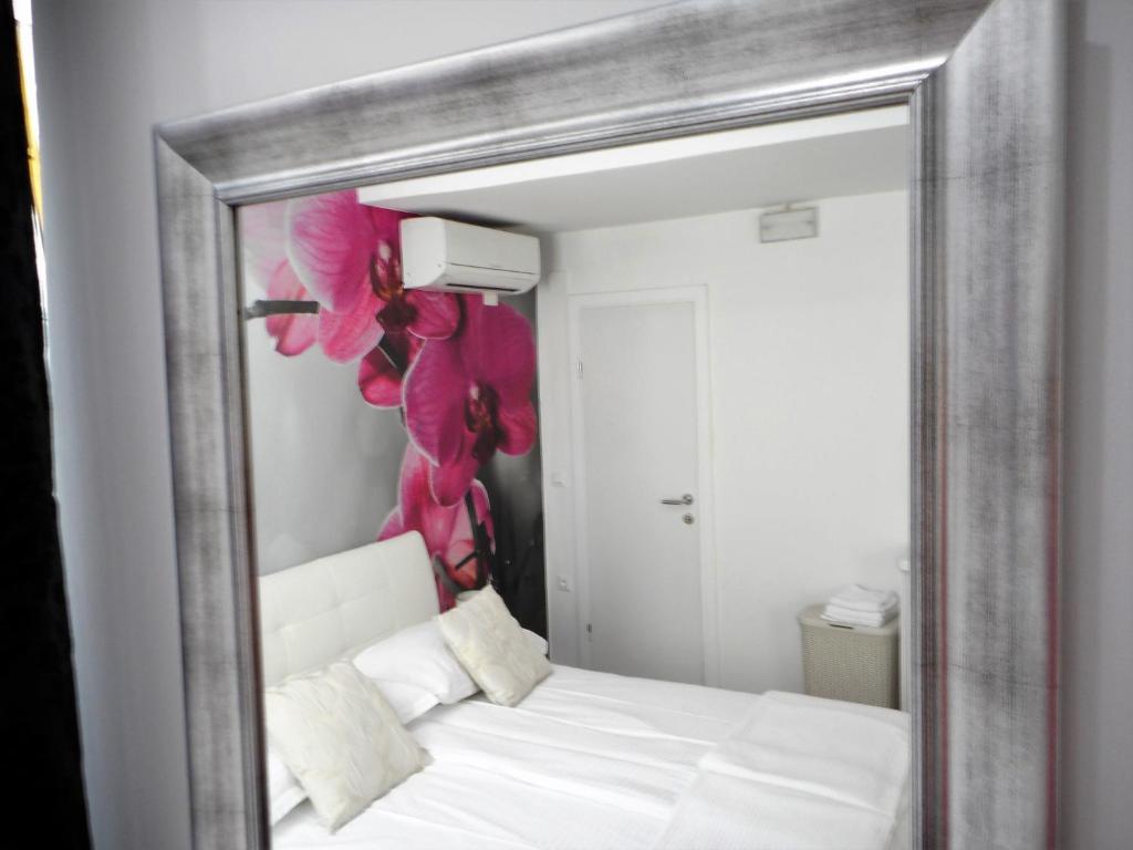 Posteľ alebo postele v izbe v ubytovaní Palladium City Center Apartments