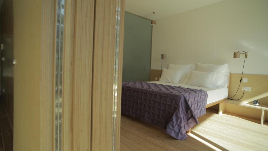 Uma cama ou camas num quarto em Colmeal Countryside Hotel