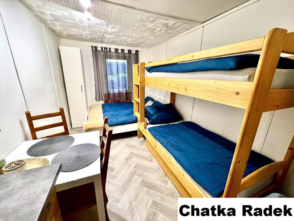 Postel nebo postele na pokoji v ubytování Chatky na Rozkoši - Radek