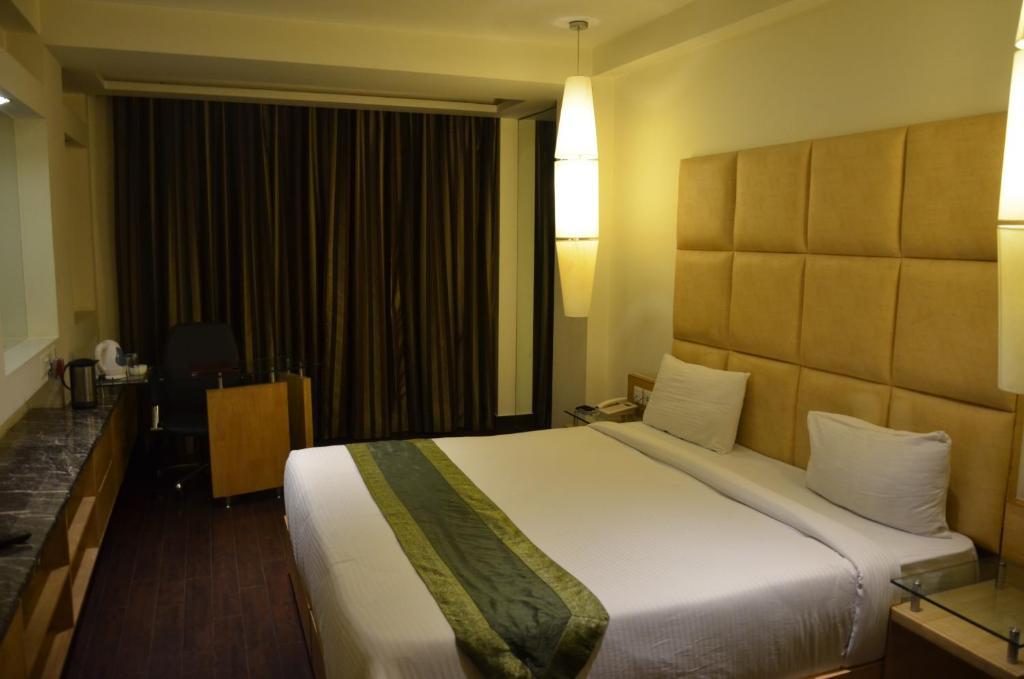 Postel nebo postele na pokoji v ubytování Airport Hotel Grand by Fantasia