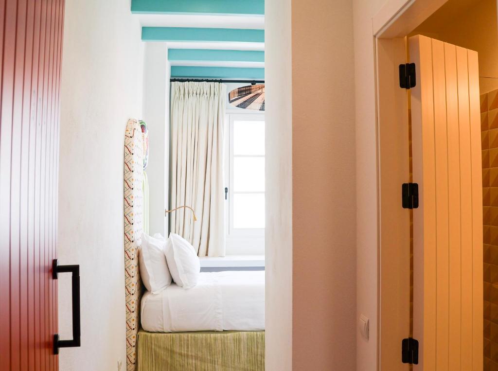 Posteľ alebo postele v izbe v ubytovaní Hotel Misiana Tarifa