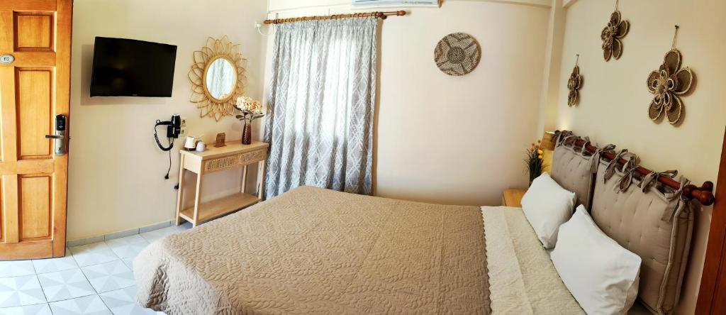 Postel nebo postele na pokoji v ubytování Hotel Anagennisis