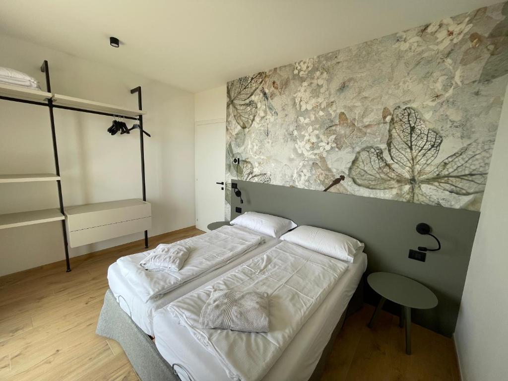 Postel nebo postele na pokoji v ubytování Residence Mirabel