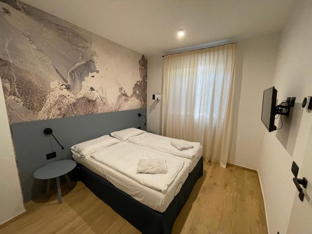 Postel nebo postele na pokoji v ubytování Residence Mirabel
