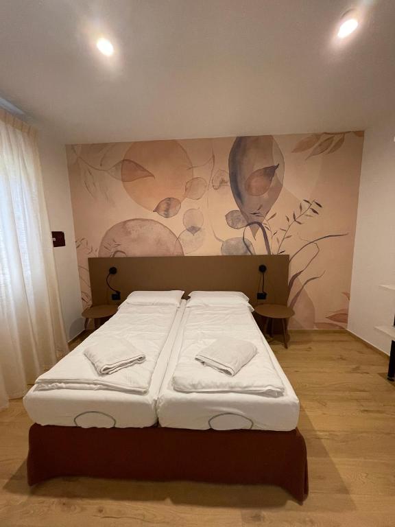 Postel nebo postele na pokoji v ubytování Residence Mirabel