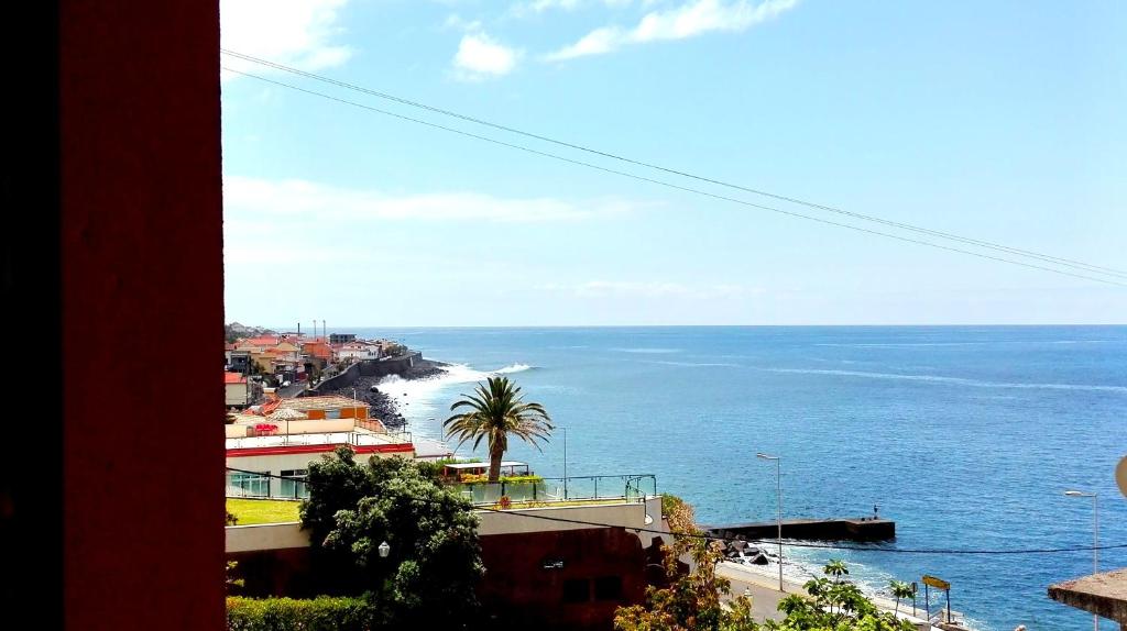 a view of the ocean from a building at Paul do Mar BY SEA in Paul do Mar