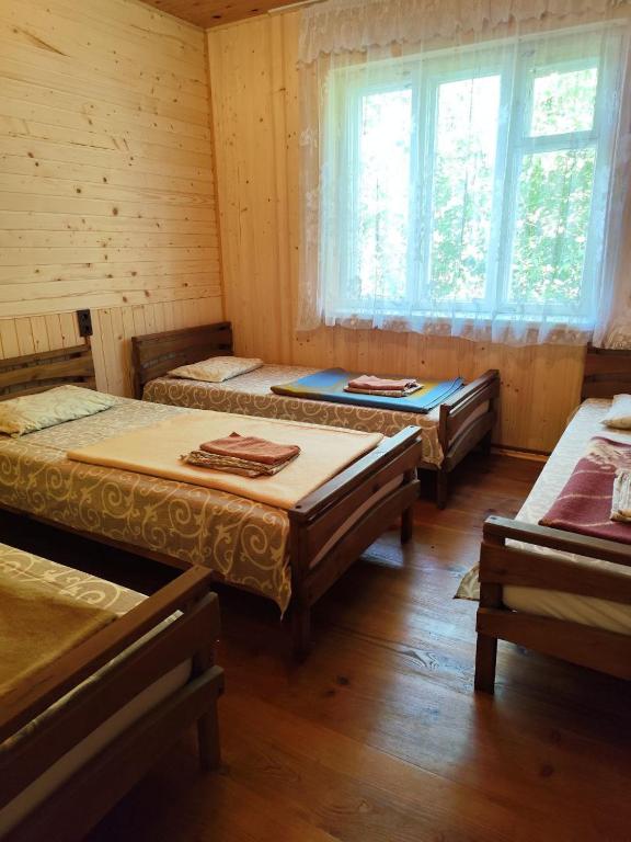 Postel nebo postele na pokoji v ubytování садиба ТУГАН-ДВІР