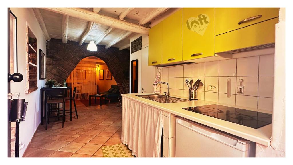 Kuchyň nebo kuchyňský kout v ubytování Centralissimo LOFT con camino romantico