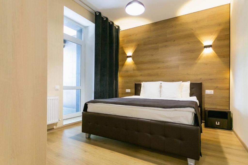 Postel nebo postele na pokoji v ubytování ROCAS Hotel
