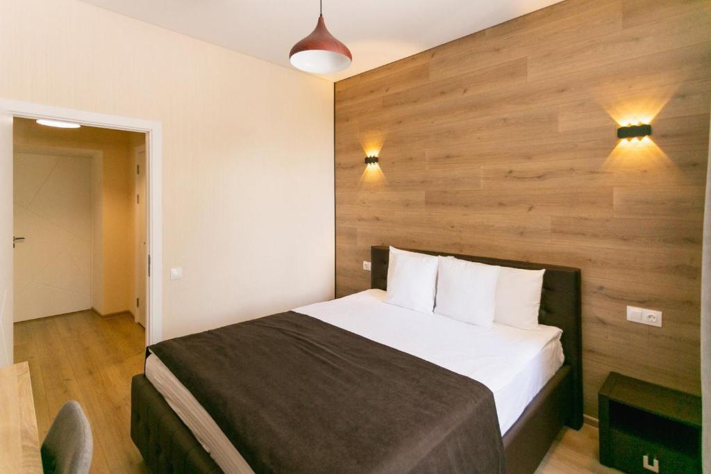 Postel nebo postele na pokoji v ubytování ROCAS Hotel