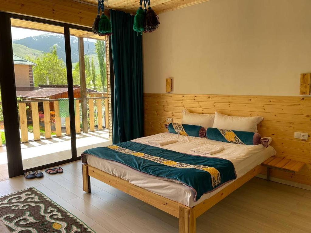 Postel nebo postele na pokoji v ubytování Guest House Jekshen