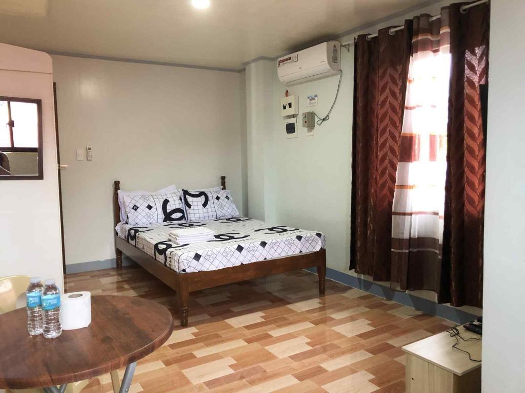 Postel nebo postele na pokoji v ubytování ZM Residence