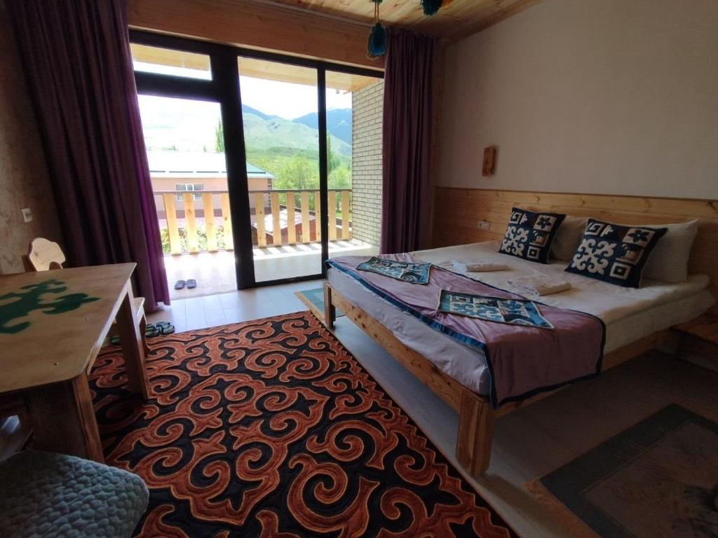 Postel nebo postele na pokoji v ubytování Guest House Jekshen