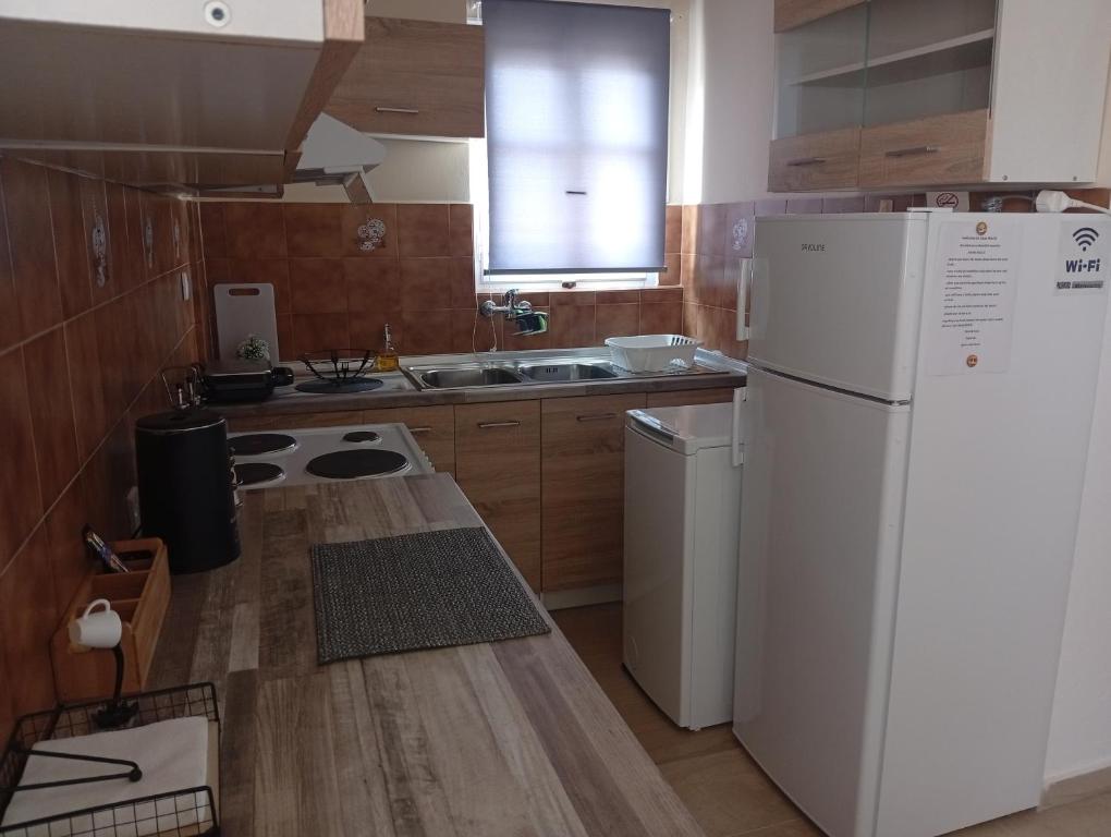 Kuchyň nebo kuchyňský kout v ubytování Casa Maria Sidari
