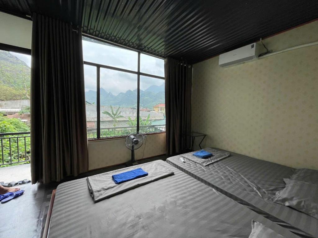 Un pat sau paturi într-o cameră la MOTEL Nguyễn Quang - Trung tâm xã Du Già - Yên Minh - Hà Giang
