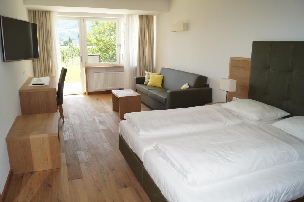 Postel nebo postele na pokoji v ubytování Hotel Greifenstein