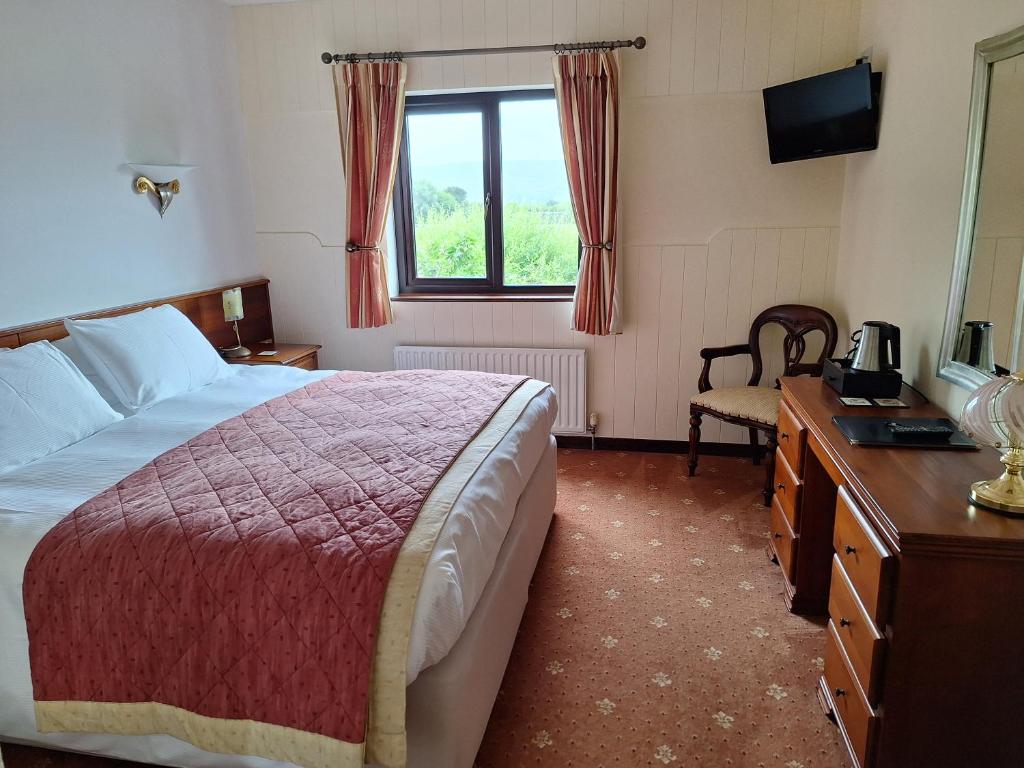 Voodi või voodid majutusasutuse Corthna Lodge toas