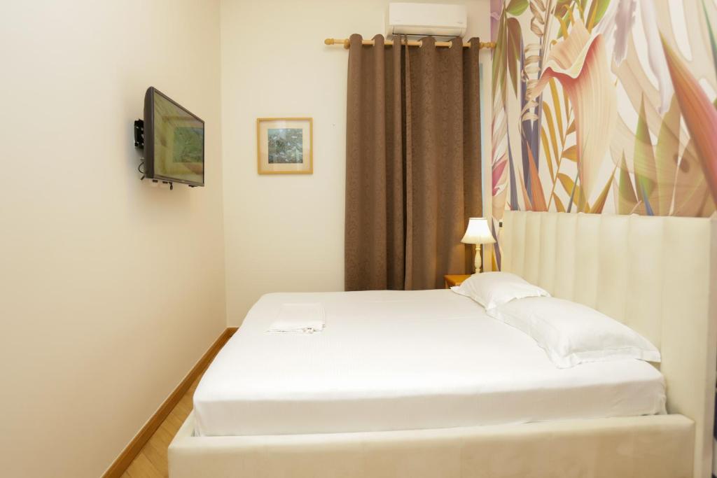TV a/nebo společenská místnost v ubytování Le Palazzine Hotel