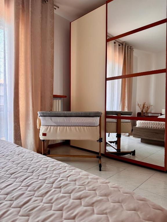 Postel nebo postele na pokoji v ubytování Garda Lake Holiday Apartments quadrilocale