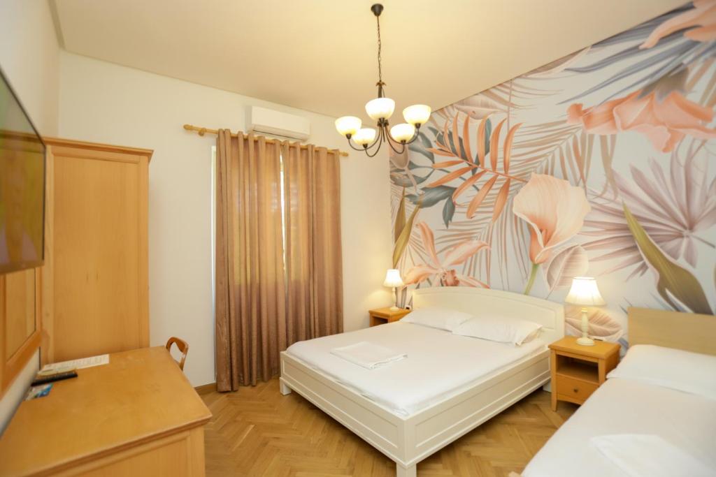 Postel nebo postele na pokoji v ubytování Le Palazzine Hotel