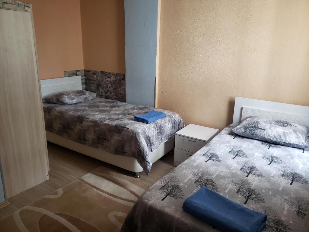 Postel nebo postele na pokoji v ubytování Ernur Pension
