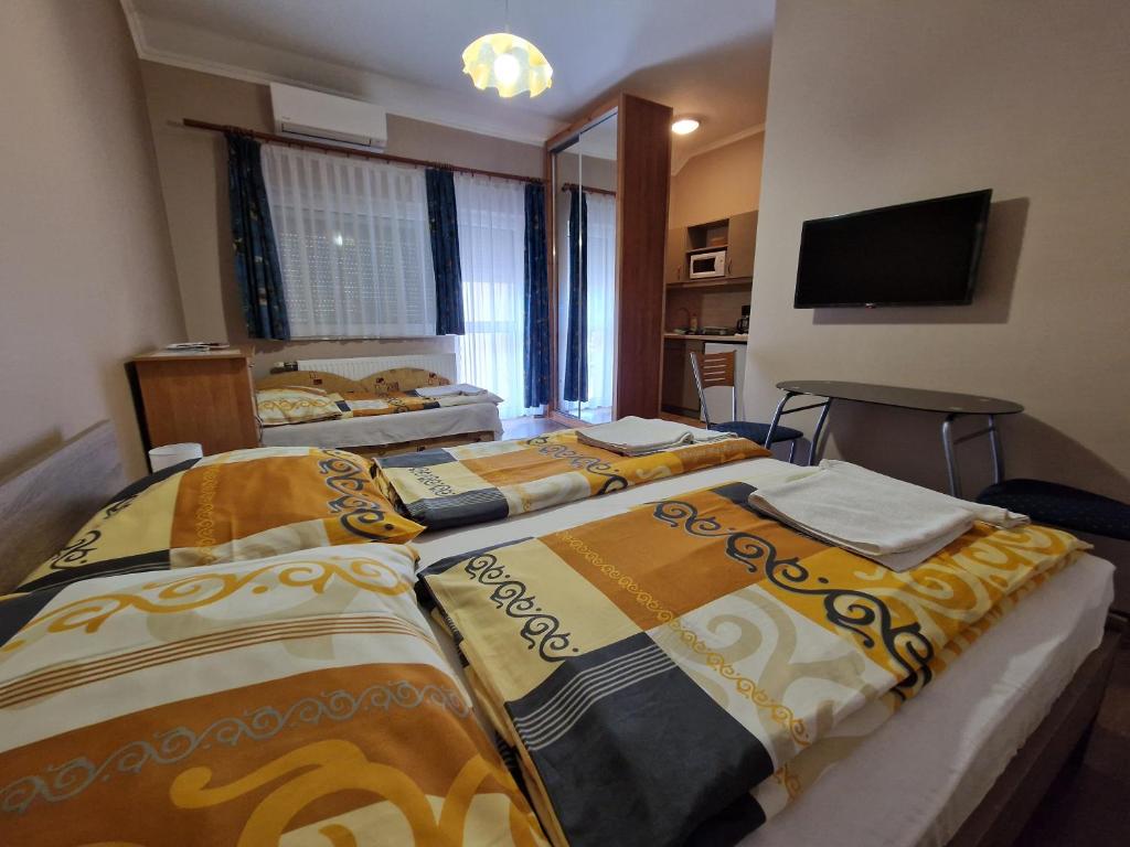 Posteľ alebo postele v izbe v ubytovaní Villa Letícia Siófok