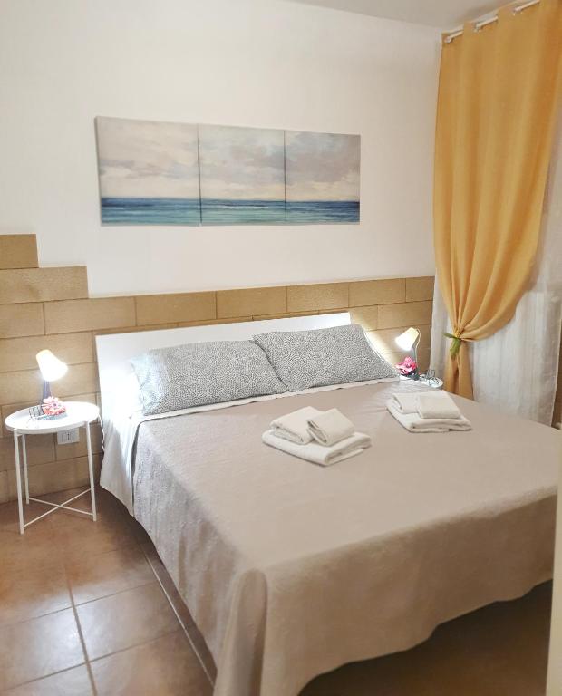 Posteľ alebo postele v izbe v ubytovaní La dimora di Don Vito - Appartamento confortevole