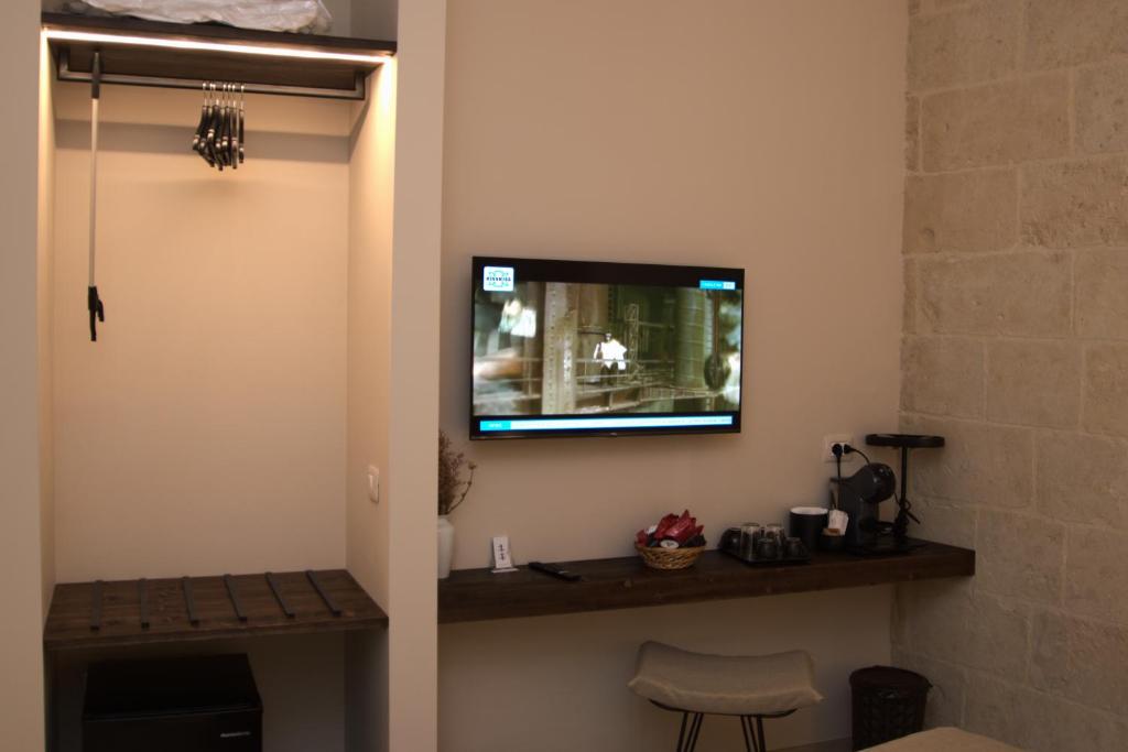 TV a/nebo společenská místnost v ubytování Dimora al Piano