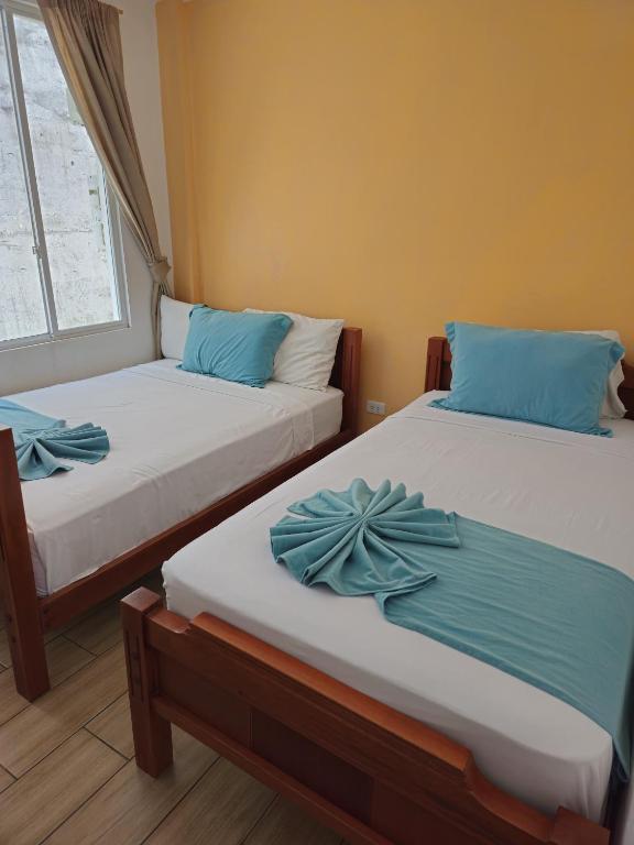 Postel nebo postele na pokoji v ubytování Coco Beach