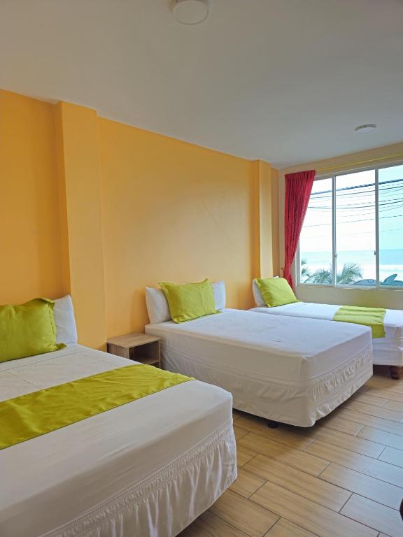 Postel nebo postele na pokoji v ubytování Coco Beach