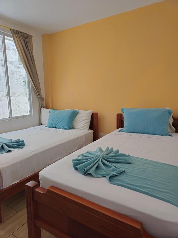 Postel nebo postele na pokoji v ubytování Coco Beach