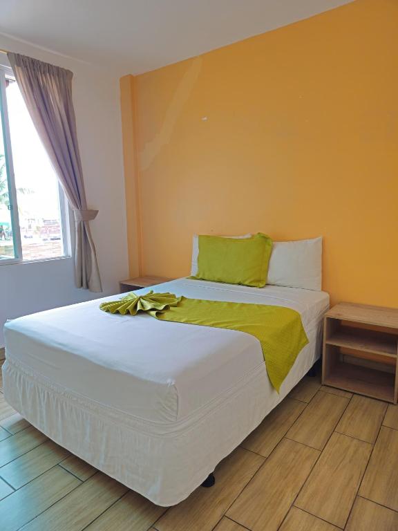 Postel nebo postele na pokoji v ubytování Coco Beach