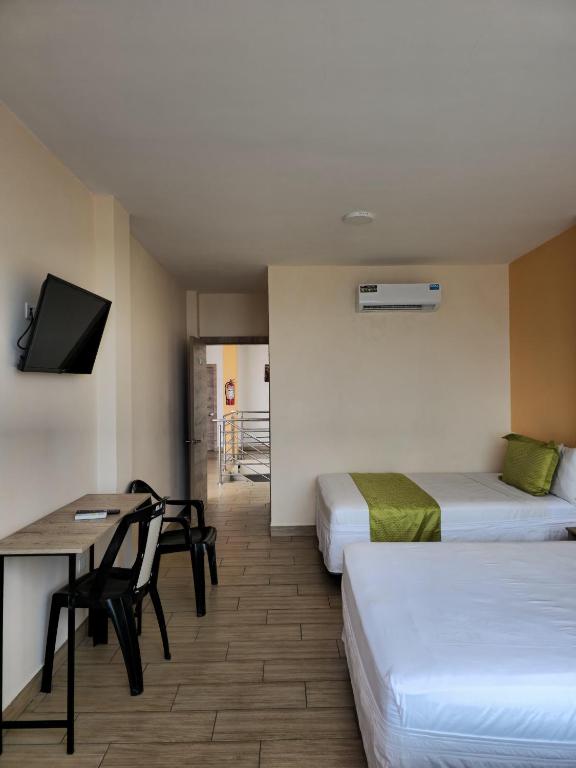 Postel nebo postele na pokoji v ubytování Coco Beach